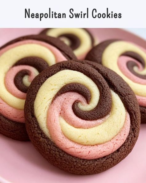 Neapolitan Swirl Cookies These Neapolitan swirl cookies combine chocolate, strawberry, and vanilla in every bite! Fun to make and even better to eat! Ingredients: 2 1/4 cups all-purpose flour 1/2 tsp baking powder 1/4 tsp salt 3/4 cup unsalted butter, softened 3/4 cup granulated sugar 1 large egg 1 tsp vanilla extract 1 tbsp unsweetened cocoa powder 1 tbsp strawberry extract or freeze-dried strawberry powder Pink food coloring (optional) Directions: In a medium bowl, whisk together flour... French Christmas Traditions, Swirl Cookies, Traditional Christmas Cake, Unsweetened Cocoa Powder, Strawberry Powder, Pink Food, Pink Food Coloring, Vanilla Cookies, Chocolate Strawberry