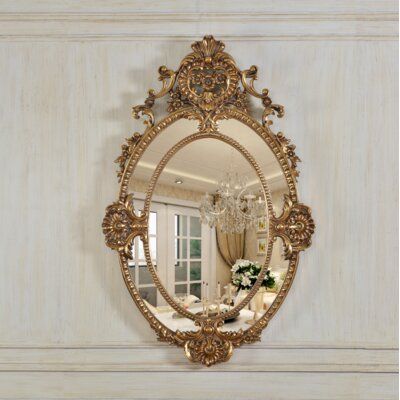 Introducing the epitome of opulence and sophistication - our highly coveted, elaborately constructed, and decorated accent mirror. Prepare to be captivated by its sheer beauty and undeniable charm. This mirror is more than just a reflection; it's a statement piece that will effortlessly steal the spotlight in any room. Crafted with meticulous attention to detail, its hand-crafted ornate finish showcases the epitome of exquisite craftsmanship. Imagine the awe-inspiring presence this mirror will b Pretty Hallway, Antique Home Decor, Golden Wall, Cheval Mirror, Sophisticated Aesthetic, Home Decor Products, Oval Wall Mirror, Accent Mirror, Mirrors Wayfair