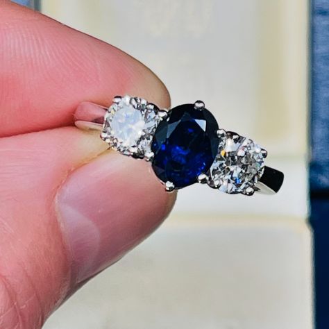 This contemporary trilogy ring, is all about the Sapphire. 💙 The oval cut central Ceylon Sapphire of a spectacular intense deep blue colour and hue, totals 2.30ct and is six claw set in between two semi-modern round cut Diamonds, totaling 1.20ct, also claw set in 18K white gold on a medium to slim band. This ring is signed by Jan Logan Jewellery. This ring is a true classic, and can most certainly be bought as an anniversary ring, an engagement or a classic dress ring 👌🏽 This ring comes wi... Blue Mountains Australia, Trilogy Ring, Emerald Cut Rings, Ceylon Sapphire, Emerald Engagement Ring Cut, Art Deco Engagement Ring, Modern Round, Dress Rings, Art Deco Ring