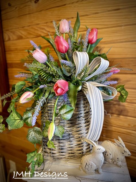 Basket Floral Centerpiece, Spring Arrangements Floral, Spring Floral Arrangements Silk, Wicker Basket Flower Arrangements, Easter Lily Arrangement For Church, Mother’s Day Floral Arrangements, Wicker Basket Floral Arrangement, Easter Floral Centerpieces, Easter Floral Arrangement