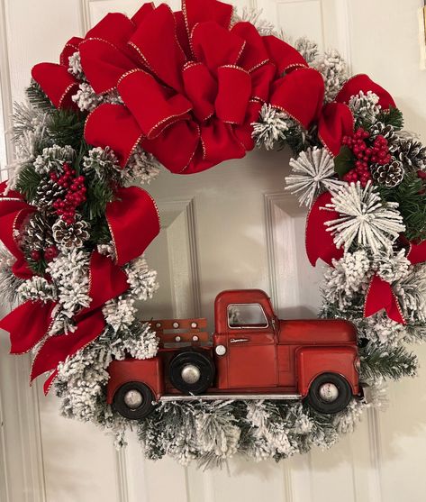 "This vintage red truck Christmas front door Wreath takes shape on a evergreen wreath base.  The wreath has flocked, full branches with lights. The lights are battery operated and require 3 AA batteries. The lights come with a hand held control with several settings.  If you prefer plug in please message me.  It is perfect to add to your Christmas front porch decorations.  This favorited farmhouse holiday door hanger comes fully loaded.  It has high quality materials: a metal Red Truck, a small Christmas Front Porch Decorations, Bedroom Wreath, Front Porch Decorations, Holiday Door Hanger, Christmas Front Door Wreath, Door Wreath Christmas, Kitchen Wreath, Cottage Wreath, Colorful Cottage