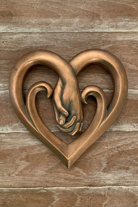 Show your love and decorate your favorite wall with this beautifully detailed bronze wall art (Heart Holding Hands plaque) from Top Brass Home Decor. Features a beautiful copper bronze verdigris finish. Made from hard / durable poly-resin material with amazing details. Metal hanger on back for easy, secure mounting. Bronze Wall Art, Brass Wall Art, Wood Sculpture Art, Room Wall Painting, Bronze Wall, Metal Hanger, Soyut Sanat Tabloları, Art Heart, Woodworking Plans Diy