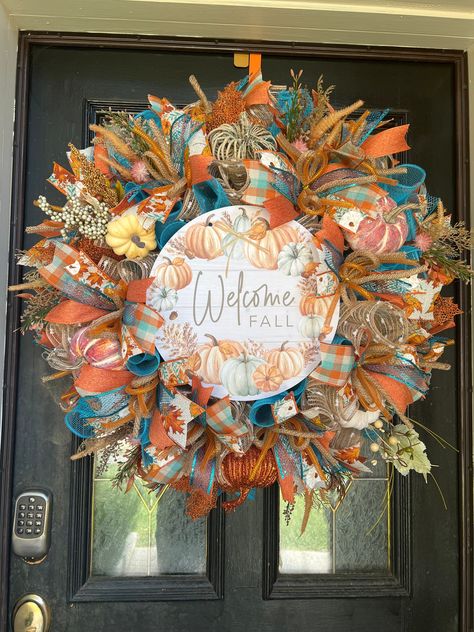 "Beautiful Fall wreath to welcome your guests this holiday season. This beautiful piece was created using evergreen pine wreath base for its fullness. Wreath has beautiful teals and oranges for that gorgeous fall look. All of my designs are made with quality material and sprays. This piece will go well in any size door. It's measuring 24\" and it's full. If you have any questions regarding this piece or any others on my shop please message me directly. Thank you" Fall Decor For Front Door, Fall Door Decor, Fall Decor Wreaths, Fall Wreath For Front Door, Fall Thanksgiving Wreaths, Orange Wreath, Teal And Orange, Harvest Wreath, Fall Door Decorations