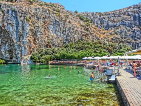 Lake Vouliagmeni spa Lake Vouliagmeni Athens, Lake Vouliagmeni, Athens Beach, Melissani Cave Greece, Spa Holiday, Ionian Sea Greece, Athens Plaka, Honeymoon On A Budget, Athens Riviera