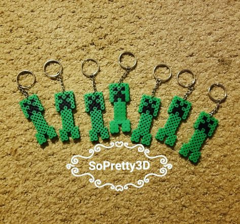 Minecraft creeper perler bead keychains Perler Bead Creeper, Creeper Perler Bead Pattern, Melty Bead Keychain, Creeper Perler Beads, Perler Keychain Ideas, Simple Perler Bead Patterns, Minecraft Perler Bead Patterns, Perler Beads Keychain, Perler Keychain