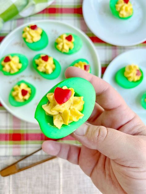 Today, we’re making Grinch Eggs! These are simply deviled eggs with a little holiday magic. We’re going to take some hard boiled eggs, dye them green, fill them with a savory filling kissed with Old Bay, then finish them off with a little red bell pepper heart. Cocoa Dip Recipe, Hot Cocoa Dip, Cocoa Dip, Winter Pasta, Grinch Party, Stuffed Mini Peppers, Fondant Stamping, Green Food Coloring, Old Bay