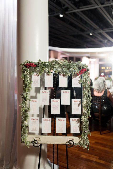 Seating chart on vintage window with Christmas garland Seating Chart Winter Wedding, Seating Chart Christmas, Seating Chart Wedding Christmas, Christmas Seating Chart Wedding, Christmas Wedding Seating Chart Ideas, Winter Wedding Seating Chart Ideas, Christmas Wedding Seating Chart, Christmas Seating Chart, Old Windows Ideas