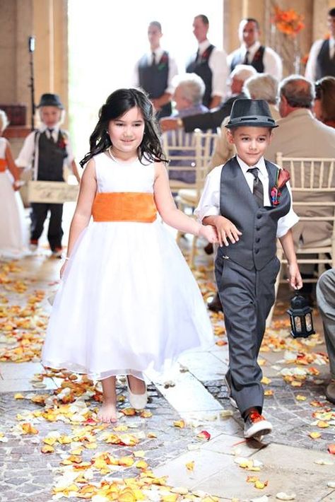 Why does the girl have one shoe on... Am I the only one to see this guys... Flower Girl Inspiration, Kids Wedding Outfits, Flower Girl Outfit, Bearer Outfit, Ring Bearer Outfit, Wedding Anniversary Party, Orange Wedding, Wedding With Kids