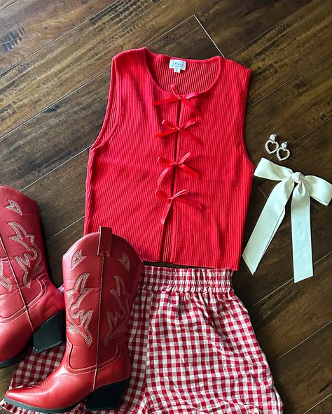 Stay cool in our Red Coquette Ribbed Knit Tie Front Sleeveless Tank Top! This cute red ribbed tank features 3 bow details down the front. The bonus? The tank is stitched behind the faux bow closures so nothing falls out of place. Plus, the material is extra soft and comfy. Pair with a black denim skort, floral jeans or your favorite denim shorts! Denim Tank Top Outfit, Palette Closet, Red Tank Top Outfit, Western Summer Outfits, Red Coquette, Denim Dress Outfit, Country Outfit, Casual Country Outfits, Denim Tank Top