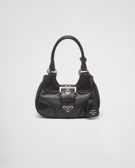 Black Prada Moon Padded Nappa-leather Bag | PRADA Sacs Design, Bag Stand, Leather Keyring, Black Purse, Pretty Bags, Triangle Logo, Bag Trends, Leather Keychain, Wash Bags