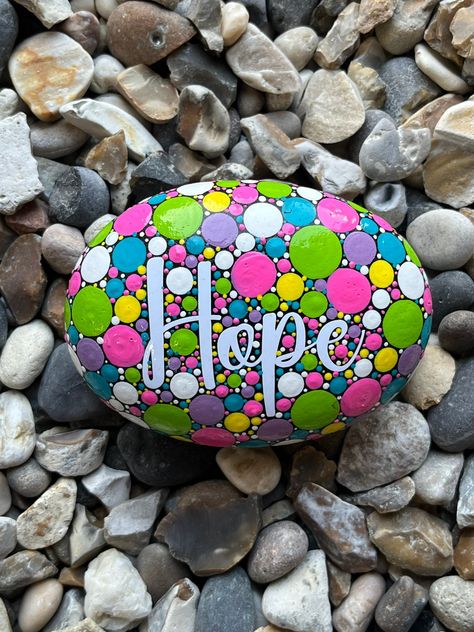 Hand Painted Hope Stone.    This natural stone has had high quality vinyl wording precisely applied then finished with a hand painted polka dot pattern.  Custom stones with personal words or messages are also available. Please see my shop listings or message me direct for more information. All my stones are carefully wrapped with tissue paper and come with a colourful gift bag as standard. A gift wrapping service is also avalible. I use high quality acrylic paints and then finish each rock off w Dotted Painted Rocks, Dot Art Painting Patterns, Dot Painting On Rocks, Decorated Stones, Stone Mandala, Polka Dot Art, Inspirational Rocks, Diy Rock Art, Rock Gifts