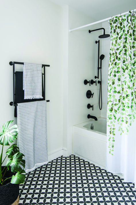 One Of A Kind — OUR HOMES Magazine – Celebrating Life at Home White Bathroom With Matte Black Fixtures, Black And White Bathroom With Green, Black White And Green Bathroom Ideas, Black And White And Green Bathroom, Black And White Bathroom With Tub, Sage Green Black And White Bathroom, Green White Black Bathroom, Black And White Bathroom With Color Pop, Black And White Tile Floor Bathroom