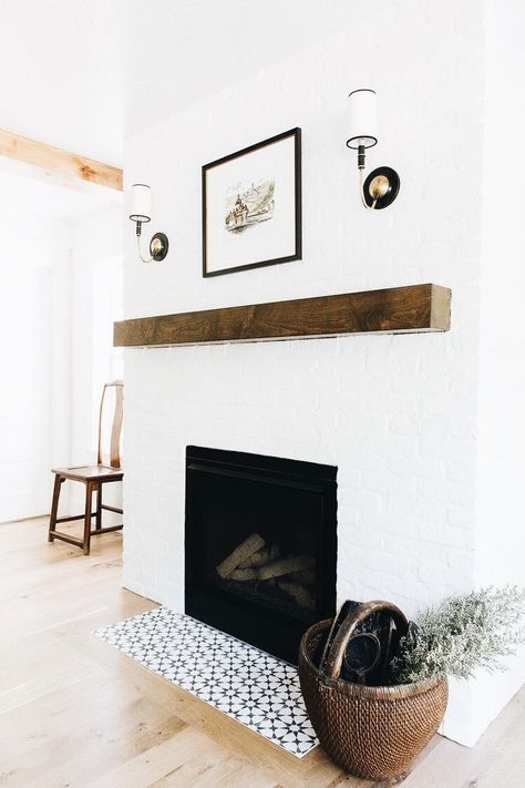 rustic wood beam fireplace mantel with painted brick and tile accents #fireplaceinspiration #fireplacemantel Wood Beam Fireplace, Brick And Tile, Beam Fireplace, White Brick Fireplace, Painted Brick Fireplace, Painted Brick Fireplaces, Modern Remodel, Dining Room Fireplace, Wood Beam