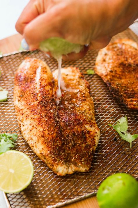 This tender and flaky chili lime tilapia is cooked to perfection in the air fryer or oven in under 15 minutes for quick and easy weeknight meal. Enjoy in tacos, burrito bowls, salads, or on its own! #airfryerrecipes #whole30 #paleo #keto #tilapia #glutenfree #dairyfree #lowcarb #quickmeals #healthyrecipe Keto Tilapia, Lime Tilapia Recipes, Air Fryer Tilapia, How To Cook Tilapia, Tilapia Recipes Easy, Baked Tilapia Recipes, Frozen Tilapia, Tilapia Recipe, Lime Butter