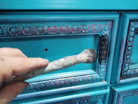 I found this great canvas of a peacock at a yard sale and knew instantly I want to paint a dresser to match. Inspiration Picture    My first step was to choose paint colors that I saw in the canvas.I knew I wanted a blue for the final coat, so I chose the accent colors. Prep    This dresser was perfect for the look I was going for. I removed the hardware so that I could paint that separately. Then I cleaned my piece with a mixture of TSP and water. Since I was using chalk paint I did n… Chalk Paint Hutch, Nyc Subway Art, Paint A Dresser, Bronze Spray Paint, Top Paint Colors, Painted Hutch, Spray Paint Colors, Whimsical Painted Furniture, Bedroom Furniture Makeover