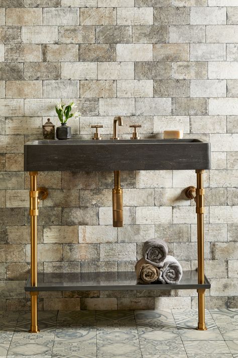 Black and gold are a timeless color combination. Here's our version in Aged Brass and Antique Gray Limestone. Elemental Trough vanity console is a modular bathroom concept that pairs stone sinks, metal legs, and storage shelving in 24" and 36" widths. Cement Sink, Stone Forest, Metal Sink, Copper Bathroom, Console Sink, Trough Sink, Stone Bathroom, Stone Sink, Metal Trays