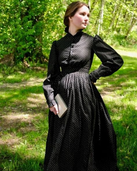 "Antique Victorian black with white dot calico dress. Ruffled band neck collar, puffed sleeves, ruffled cuffs, and button front bodice. Bodice and sleeves are fully lined in brown cotton. Black jet buttons with hand stitched button holes. Fitted waist with tightly gathered back and lightly gathered front. Skirt is unlined. Condition is excellent with the top button being different than the others. No other flaws were found. Hand washed and ready to wear. Fit is an extra-small. Model wear a size Sewing A Victorian Dress, Victorian Historybounding, Victorian Outfits Women, 1600s Dress, Victorian Day Dress, 1890 Dress, Black Victorian Dress, Victorian Fashion Women, Working Dresses