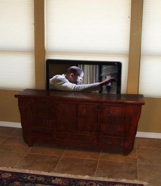 Hidden flat screen TV. Possible with TV lifts from http://www.homecontrols.com/Home-Audio/TV-Wall-Mounts/Main-Category/Home-Audio/Type/Lift Lift Apartment, Pop Up Tv Cabinet, Hidden Tv Cabinet, Rustic Wood Cabinets, Space Saving Apartment, Tv Lift Cabinet, Tv Lift, Hidden Tv, Flat Screen Tv