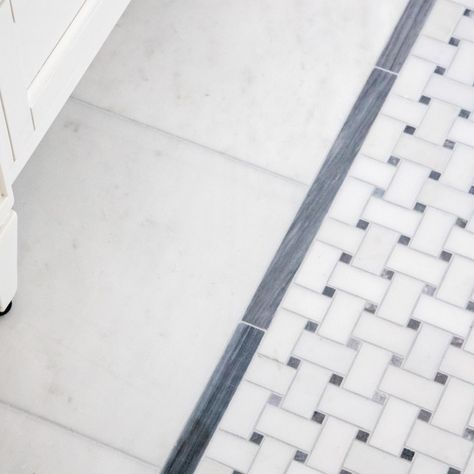 In the master bathroom, we incorporated a double vanity and relocated the toilet (the former bathroom had only a small single vanity with the toilet awkwardly located directly in front of the door). A beautiful Calacatta and Bardigiglio Gray basketweave tile was used in combination with various sizes of Calacatta marble field tile and trim for a look that is both elegant and timeless. Carrara Basketweave Tile Bathroom, Basketweave Tile With Border, Basketweave Tile Floor With Border, Marble Bathroom Floor With Border, Basketweave Marble Tile Bathroom Floor, Basketweave Tile Floor Bathroom, Grey Basketweave Tile Bathroom, Black And White Basketweave Tile Bathroom, Bathroom Floor Mosaic Tile Ideas