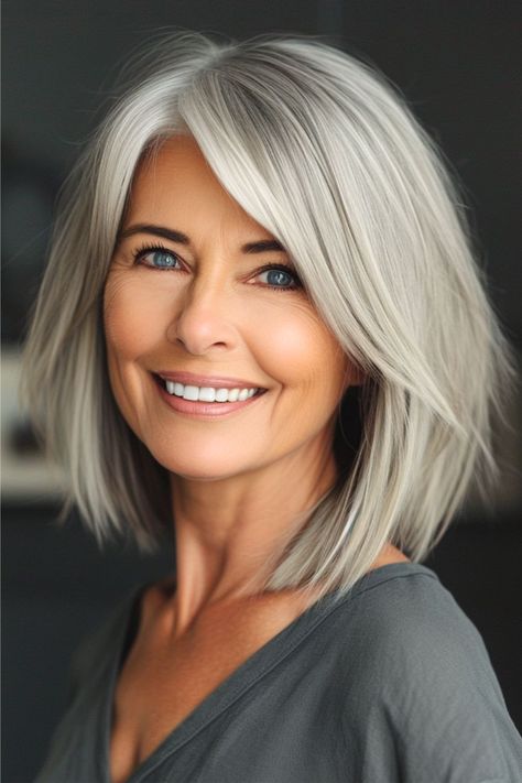 Silver Layered Lob Haircut for Women Over 50. Middle Age Bob Over 50, Lob Haircut Grey Hair, Bobs For Grey Hair Over 50, Choppy Layered Bob Straight Hair, Women’s Layered Bob, Shoulder Length Hair Grey, Top Hairstyles For 2024, Bobs For 50 Year Old Women, Outfits For Grey Hair