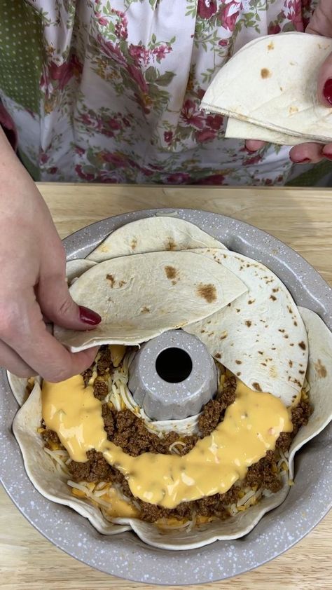 Easy taco dinner | taco, dinner | Easy taco dinner Kiera J takes a bundt cake pan and make a new type of taco This video was produced by Kiera J and Network Media, LLC. | By Kiera & Ryan & Danny & Justine | Facebook | Just making me a little ring of these tortillas inside this bump pan. And y'all I'm using the fajita size ones. These are my favorite size. I just think they're perfect for just about everything I need them for. I went ahead and ground me up some ground beef. And I added a little Bundt Cake Casserole, Taco Ring With Tortillas Bundt Pan, Taco Bundt Cake, Bundt Pan Taco Ring, Easy Taco Dinner, Dorito Taco Casserole, Bubble Up Enchiladas, Taco Casserole Bake, Bundt Pan Recipes