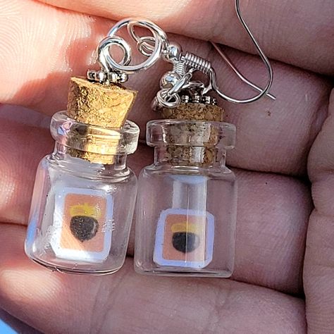 Small corked bottle earrings with a small card depicting an acorn on an orange background Animal Crossing Jewelry, Animal Crossing Earrings, Animal Crossing Diy, Wareham Massachusetts, Diy Jars, Nerdy Jewelry, Y2k Earrings, Nerdy Gifts, Anime Jewelry