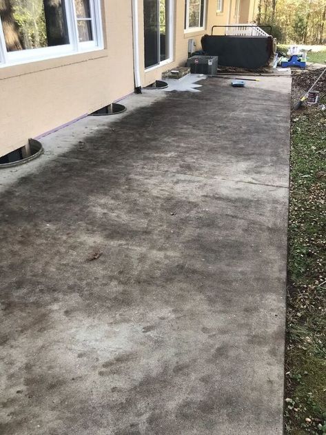 I transformed our ugly old concrete patio with some cleaning and an easy-to-apply tinted sealer!Here's how to do it yourself... When we moved into our new house the back concrete patio was in rough shape.It had been stained over the years from leaf debris and dirt ground into concrete that I suspect was never sealed. I started out by using this Purple Power Driveway & Concrete Cleaner.I diluted it according to the instructions and applied it with a stiff brush. Well after I used… Resurfaced Concrete Patio, Old Sidewalk Makeover, Diy Stained Concrete Patio, Sealing Concrete Patio, Black Stained Concrete Patio, Concrete Patio Coating, How To Seal Concrete Patio, Clean Concrete Patio, Cement Staining Outdoor