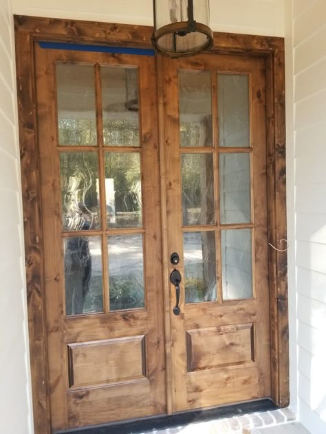 Cottage Double Front Doors, Exterior Double Doors With Glass Panels, Farmhouse Sliding French Doors, Exterior French Doors Farmhouse, Barndominium French Doors, Double French Doors Exterior Entrance, Rustic Exterior Double Doors, Exterior Doors With Glass Panels Farmhouse, Farmhouse Front Door Stain Colors