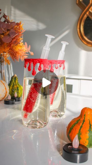 The Spritz Effect | Sarah Louise on Instagram: "VAMPIRE MIMOSAS 🧛🏼‍♀️💉🩸

Bringing this drink back (real ones remember it from last year), and making it even better with juice syringes & icing rims! 

You can use any red juice you like — pomegranate, cranberry, cherry, etc. — and of course for a little extra flair y’all know I love to add in some edible glitter from @fancysprinkles! I ordered food safe syringes and sucked the red liquid into them, put the cap on, then popped them into my glasses rimmed with red frosting and filled with champagne. 

When you’re ready to combine, just syringe the juice into your champs and enjoy! Cheers & don’t forget to follow for more fun drinks this spooky season. 🫶🏼👻

#thespritzeffect #halloween #halloweendrinks #halloweencocktails #spookydrinks #h Ordered Food, Red Frosting, Red Juice, Red Liquid, Sarah Louise, Halloween Cocktails, Halloween Drinks, Edible Glitter, Halloween Haunted Houses