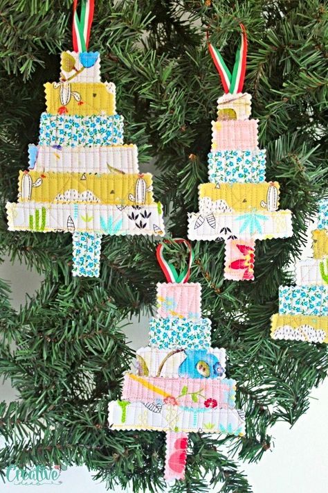 "Looking to add a fresh and creative touch to your holiday décor? Look no further! In this easy peasy tutorial I’ll show you a simple and fun way to ditch the traditional ornaments and create stunning quilted Christmas tree ornaments with ease using nothing but scraps from old quilting projects, thread, a piece of ribbon and your sewing machine. So let’s spice up your holiday décor by crafting stunning quilted Christmas ornaments from quilted fabric scraps. " Quilted Christmas Tree, Traditional Ornaments, Quilted Ornaments, Quilted Christmas Ornaments, Quilted Gifts, Christmas Tree Crafts, Felt Christmas Tree, Mini Ornaments, Ornament Tutorial