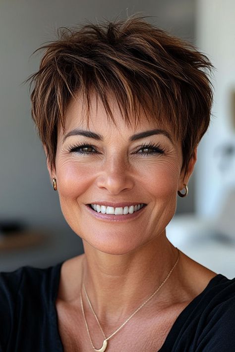 Rich Brown with Hints of Auburn Pixie, low-maintenance choppy pixie haircut for women over 50 Short Hairstyles For Women Over 50, Choppy Pixie Haircut, Auburn Pixie, Haircut For Women Over 50, Pixie Haircut For Women, Pixie Cut With Highlights, Spikey Short Hair, Choppy Pixie, Pixie Haircuts For Women