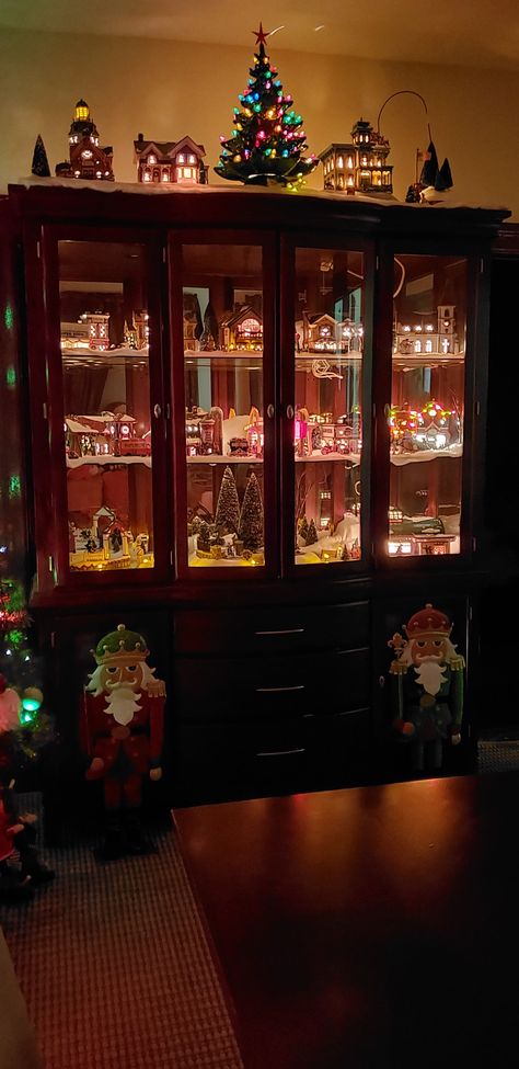 Holiday China Cabinet Display, Christmas Village Display Cabinet, Christmas Village China Cabinet, Christmas Mini Houses Display, Christmas China Cabinet Display, China Cabinet Christmas Display, Christmas Village Cabinet Display, Christmas Village Storage Ideas, Decorating China Cabinet For Christmas