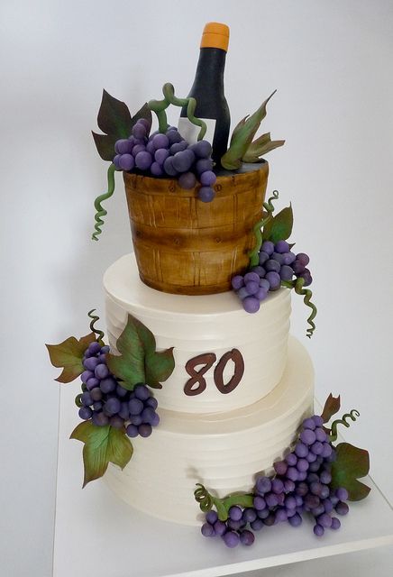 wine cake    Cake iced in buttercream, except for top tier, shaped and covered in fondant. Gumpaste grapes, leaves, vines, and wine bottle. Grapes Cake, Wine Theme Cakes, Wine Cakes, Wine Bottle Cake, Barrel Cake, Wine Cake, Grapes Leaves, Bottle Cake, Wedding Cake Photos