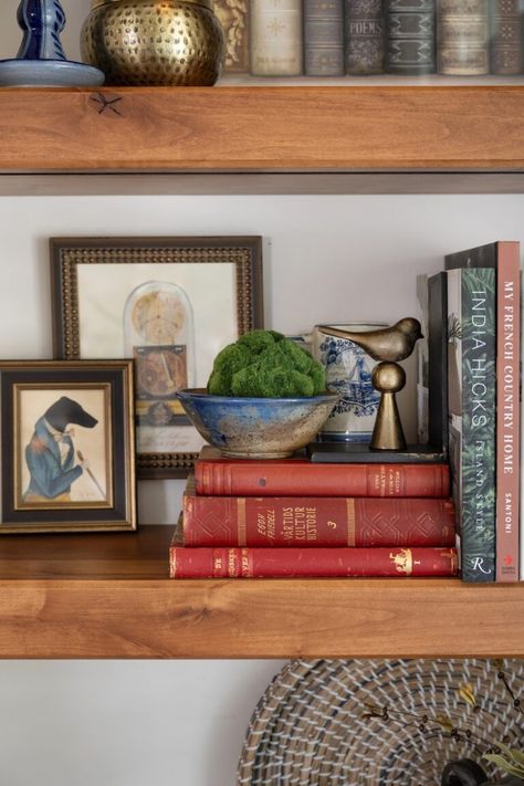 Countryside Retreat: At Home with an Interior Stylist  - Nell Hill's Man Shelf Decor, Ralph Lauren Bookshelf Styling, How To Style The Top Of A China Cabinet, How To Display Nick Nacks, Brown Bookshelf Styling, Wood Bookshelf Styling, Vintage Bookcase Aesthetic, Antique Bookshelf Decor, Vintage Bookshelf Styling