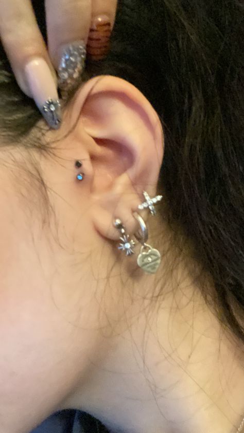 #chromehearts #piercing #tragus #tiffany Two Tragus Piercing, Different Earrings In Each Ear, Triple Lobe Piercing Silver, Small Ears With Piercings, Earring Set Up, Tragisch Piercing, Gauges And Ear Piercings, Ear Piercings Grunge, Coquette Piercings