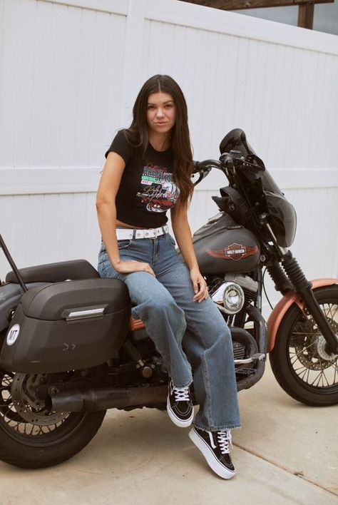 Girl hanging out by the motorcycle wearing Full Tilt Racing Car Baby Tee. Large graphic screened on front. Ribbed crew neckline. Short sleeve. Fitted silhouette. Cropped. 50% Cotton, 50% Polyester. Streetwear Fashion Simple, Vans Tshirt Outfits, Grunge Rock Outfits For Women, White Band Tee Outfit, 2024 Outfit Inspo Women, Band Girl Outfit, Tough Girl Outfits, Cute Vans Outfits, Summer Long Sleeve Outfit