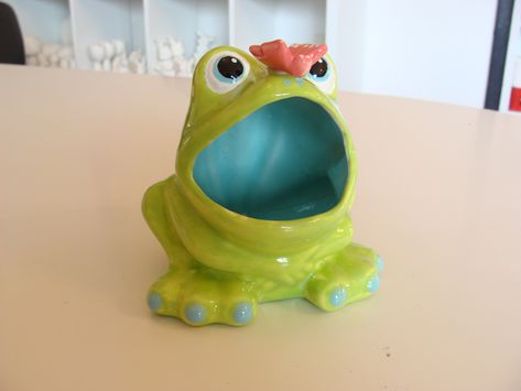 Come paint a vintage frog sponge holder with a contemporary twist! We use bright spring colors to create this fun kitchen frog and add a butterfly to his nose for this little guy to stare at. This frog is just like the ones your grandparents have. Use it as a sponge holder or as a fun and unique succulent planter. We use food safe glazes so you can display this guy indoors or outdoors. Bright Spring Colors, Vintage Frog, Fun Kitchen, Kitchen Crafts, Sponge Holder, Bright Spring, Succulent Planter, A Butterfly, Spring Colors