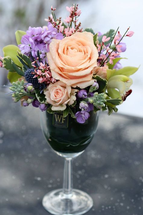 By Willow Floristry Wine Glass Arrangements, Wine Glass Vase Centerpiece, Wine Glass Floral Centerpieces, Elegant Bridal Shower Centerpieces, Wine Glass Flower Centerpiece, Wine Glass Bouquet, Flower Arrangements In Wine Glasses, Wine Glass Floral Arrangements, Wine Glass Flower Arrangement