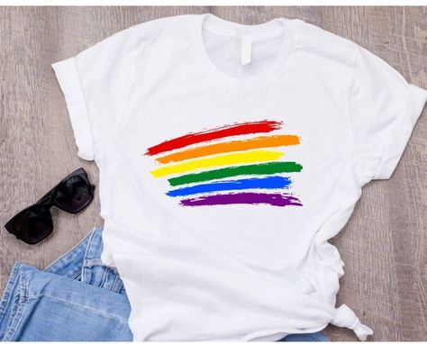 off a relaxed and stylish vibe. This Gay Pride T-shirt is perfect for anyone looking for a subtle yet fashionable way to show their support and pride. Made from soft and comfortable fabric, it's great for wearing to pride parades or simply as a statement piece in your everyday outfit. Stand out and show your pride with this trendy tee! Rainbow Tshirt Diy, Pride Shirt Ideas, Pride Clothes, Shirt Upcycle, T Shirt Upcycle, Lesbian Shirt, Lgbtq Fashion, Pride Fashion, Lgbtq Clothing