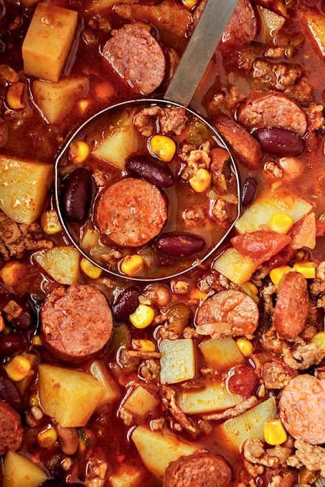 This easy Cowboy Stew recipe is made with bacon, ground beef, & sausage for a hearty dinner. It's the perfect stew to warm you all winter! Smoked Sausage Stew, Sausage Stew Recipes, Texas Stew, Texas Cowboy Stew Recipe, Cowboy Stew Recipe, Texas Cowboy Stew, Cowboy Food, Cowboy Stew, Cowboy Casserole