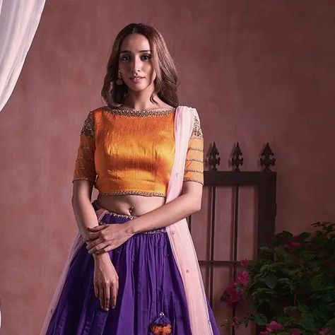 Mahitha Prasad on Instagram: "Make a striking statement with this vibrant orange boat neck blouse that perfectly complements the stunning purple Chanderi skirt. The jewel embroidery adds a touch of elegance to the overall ensemble, while the tulle sequence dupatta adds a playful and feminine touch. A unique and rare combination that is sure to turn heads at any occasion. Rajasi's exquisite designs and embroidery are perfect for the modern Indian woman who wants to showcase her elegance and styl Jewel Embroidery, Boat Neck Blouse, Indian Woman, The Jewel, Vibrant Orange, Exquisite Design, Boat Neck, The Modern, Overalls