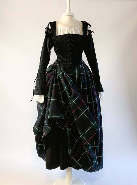 Our Renaissance Costume in Black Velvet & Mackenzie Tartan Skirt will be perfect for all your reenactments from the Tudor and Elizabethan eras, your theatrical performances, or Renaissance fairs and medieval events. The basic costume features the black velvet corset with removable sleeves and the MacKenzie plaid pleated skirt. The removable sleeves are attached to the bodice with small velvet ties. You have four purchase options to complete your costume: - the basic costume - the basic costume + Heritage Outfits, Black Velvet Corset, Scottish Costume, Mackenzie Tartan, Scottish Dress, Velvet Corset, Black Watch Tartan, Tartan Skirt, Clothes Vintage