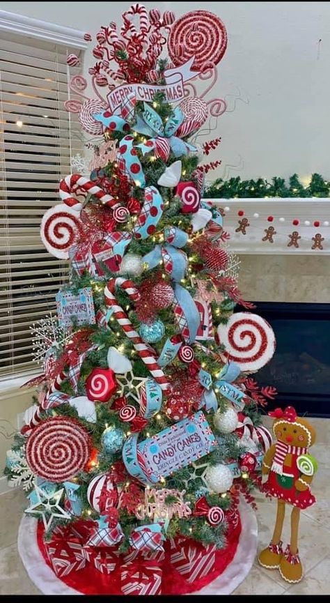 Big Christmas Tree Ornaments, Peppermint Decorations Diy, Sweet Treats Christmas Tree, Santa Tree Ideas, Candy Trees Christmas, Candy Christmas Tree Ideas, Big Ornaments On Tree, Sweets Christmas Tree Theme, Christmas Tree Contest Ideas