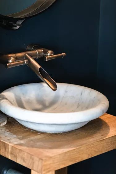 Choosing a Vanity Top and Cabinet for a Vessel Sink | Hunker Vessel Sinks Bathroom, Vessel Sinks Bathroom Vanity, Colored Sinks, Cabinet Vanity, Vessel Sink Vanity, Granite Vanity Tops, Sinks Bathroom, Drain Pipe, Cabinetry Design