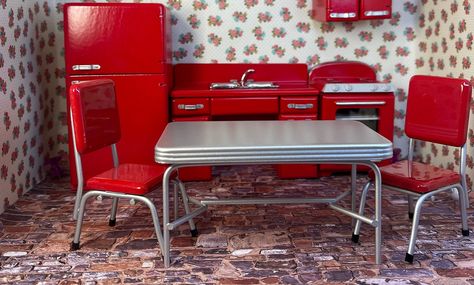 I am offering a unique set of dollhouse 1:12 furniture. It is my mother's...no not really...but looks like her kitchen in the 1950s. My mother liked anything red during that period so we had red cabinets, red vinyl covered chairs, red walls and more. This is a miniature variation. The set includes a red wood refrigerator, stove and sink with a cabinet table and 2 chairs. This is a very nice set of nostalgia. It will only be the folks in their 70s and 80s that remember when the kitchens looked li Wood Refrigerator, Red Refrigerator, Red Cabinets, Red Kitchen Decor, Cabinet Table, Dollhouse Miniatures Kitchen, Hanging Cabinet, Red Vinyl, Red Wood