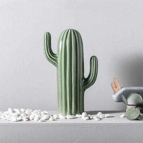 Introduce a distinct flair to your furnishings with the  Ceramic Green Cactus Decor. Meticulously crafted, this item is sure to captivate your visitors with its uniqueness.
This striking decorative object is perfect for enhancing any space, making it an exceptional gift for art enthusiasts or a fantastic addition to your own living area.
Product Details:


Size: As depicted in the images


Material:  Ceramic


Feature: Premium quality and completely brand new.


Package: Sturdy Carton Box. Ceramic Cactus, Living Simply, Cactus Decor, Green Cactus, Live Simply, Minimalist Home Decor, Nordic Style, Green Plants, Built Ins