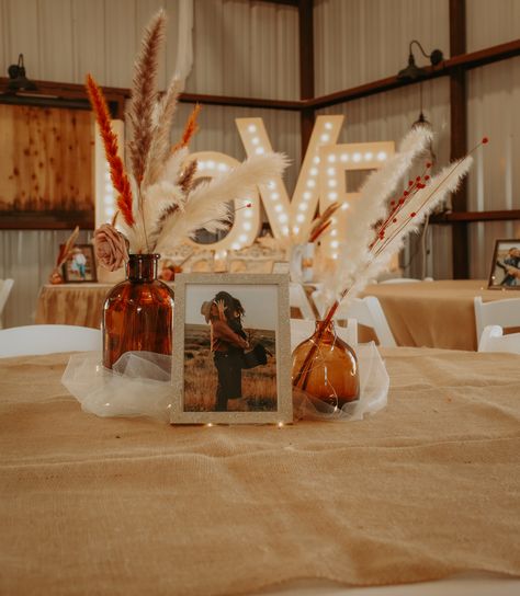 Wedding Ideas May Colors, Table Decor Boho Wedding, Boho Western Wedding Table Centerpieces, May Western Wedding, Western Centerpiece Ideas Wedding, Boho Rustic Centerpieces Wedding, Rust Wedding Centerpieces, Boho Rustic Wedding Decor Reception Ideas, Boho Wedding Diy Decor