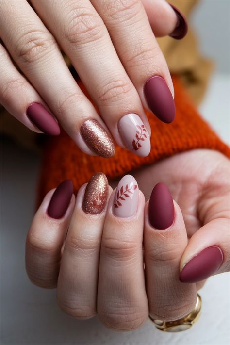 Embrace the charm of autumn with these elegant oval fall nail ideas that capture the essence of the season. Imagine rich burgundy, warm caramel, and deep forest green shades adorning your nails in a stunning oval shape, creating a chic and sophisticated look. Add delicate gold leaf accents for a touch of glamour, making your manicure the perfect accessory for cozy sweaters and crisp walks. Get inspired and let your nails reflect the beauty of fall! Fall Nails Short, Nails Short Oval, Fall Nail Ideas, Deep Forest Green, Sweater Nails, Green Shades, Rich Burgundy, Cozy Season, Deep Forest