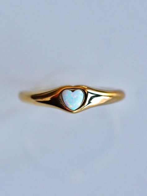 Perfect for every day, every look, and every aesthetic, the Opal Signet Ring is the perfect piece for any ring collection! The classic signet style is updated with a touch of Serendipity magic with a mesmerizing yet dainty opal heart taking center stage. Understated yet eye-catching, the opal signet ring is perfect for any stacked ring look or as a stand alone stunner. 💕 Don't know your ring size? View our Ring Size Guide …………………………………. RING SIZE & MATERIAL❋ water resistant 14k gold plated stai Heart Opal Ring, Signet Ring Aesthetic, Opal Heart Ring, Every Aesthetic, Gold Signet Ring, Ring Collection, Waterproof Jewelry, Everyday Rings, Jewelry Lookbook