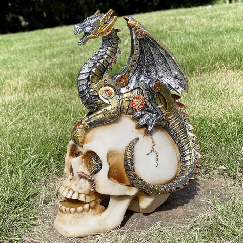 PRICES MAY VARY. Dragon Assassin on Skull Gothic Decor Statue Figurine, Great detail, totally steampunk with class! This Steampunk Dragon on Skull measures HEIGHT 7.28" LENGTH 5.31" WIDTH 4.13". Halloween Decorative Steampunk Skull made of Premium Cold Cast Polyresin ; Superb Detailing And Hand Painted Accents Really Bring Statue To Life! Sturdy and durable, a must-have for people who love unique creative gifts on birthdays, Theme Party, Halloween, Day of the dead season, Christmas & housewarmin Steampunk Dragon, Gear Design, Skull Statue, Decor Statue, Steampunk Decor, Dragon Decor, Decoration Halloween, Fantasias Halloween, Skull Fashion